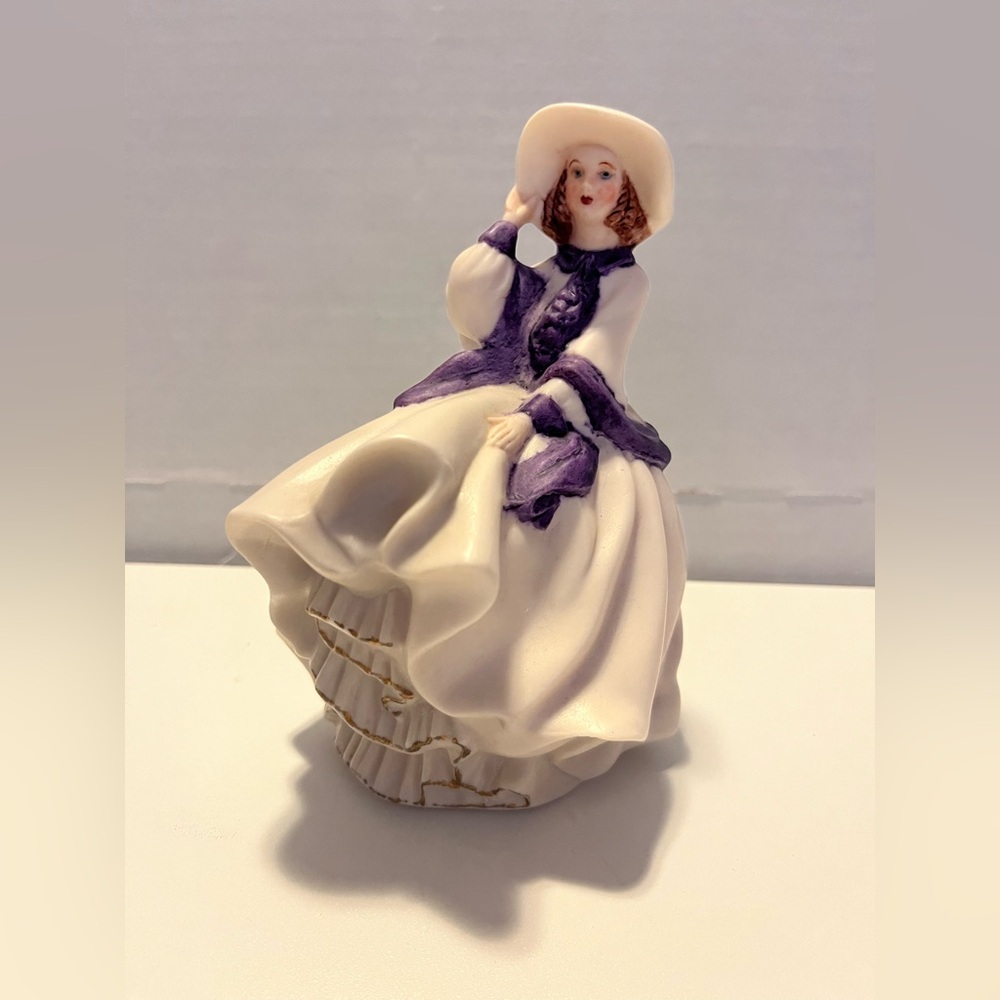 Elegant Porcelain Figurine with Purple Accents